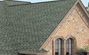 Grey shingle roofing on a brick house